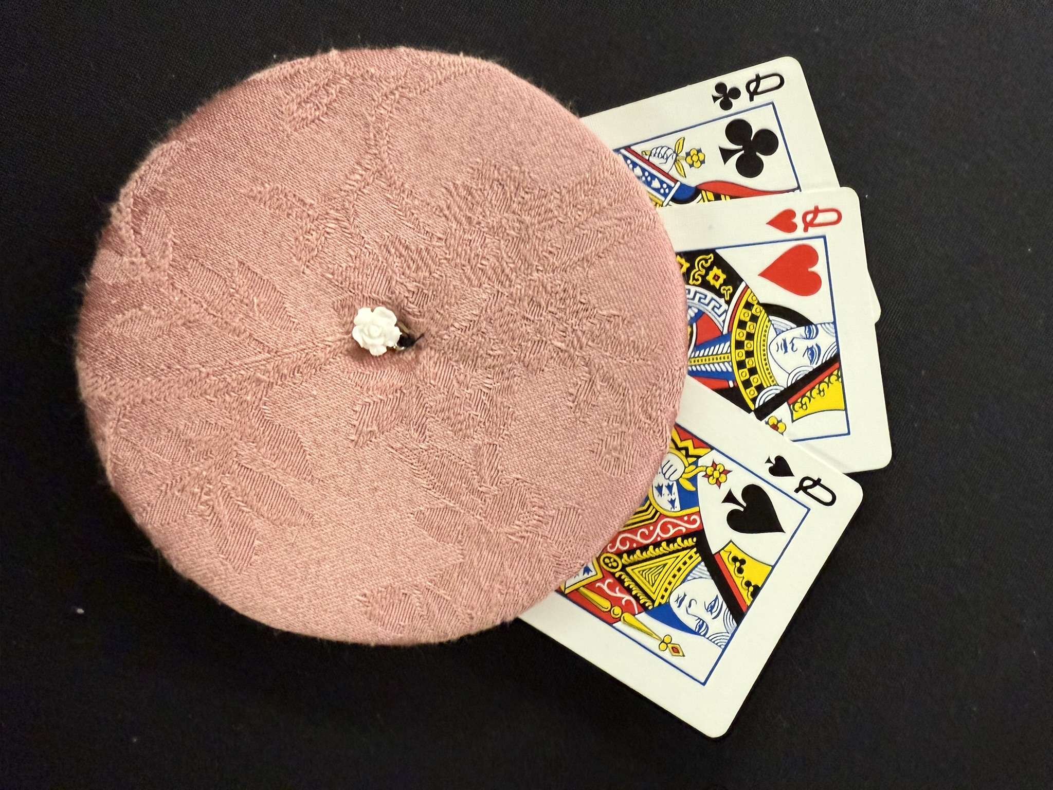 muted pink playing cards holder with white rose charm