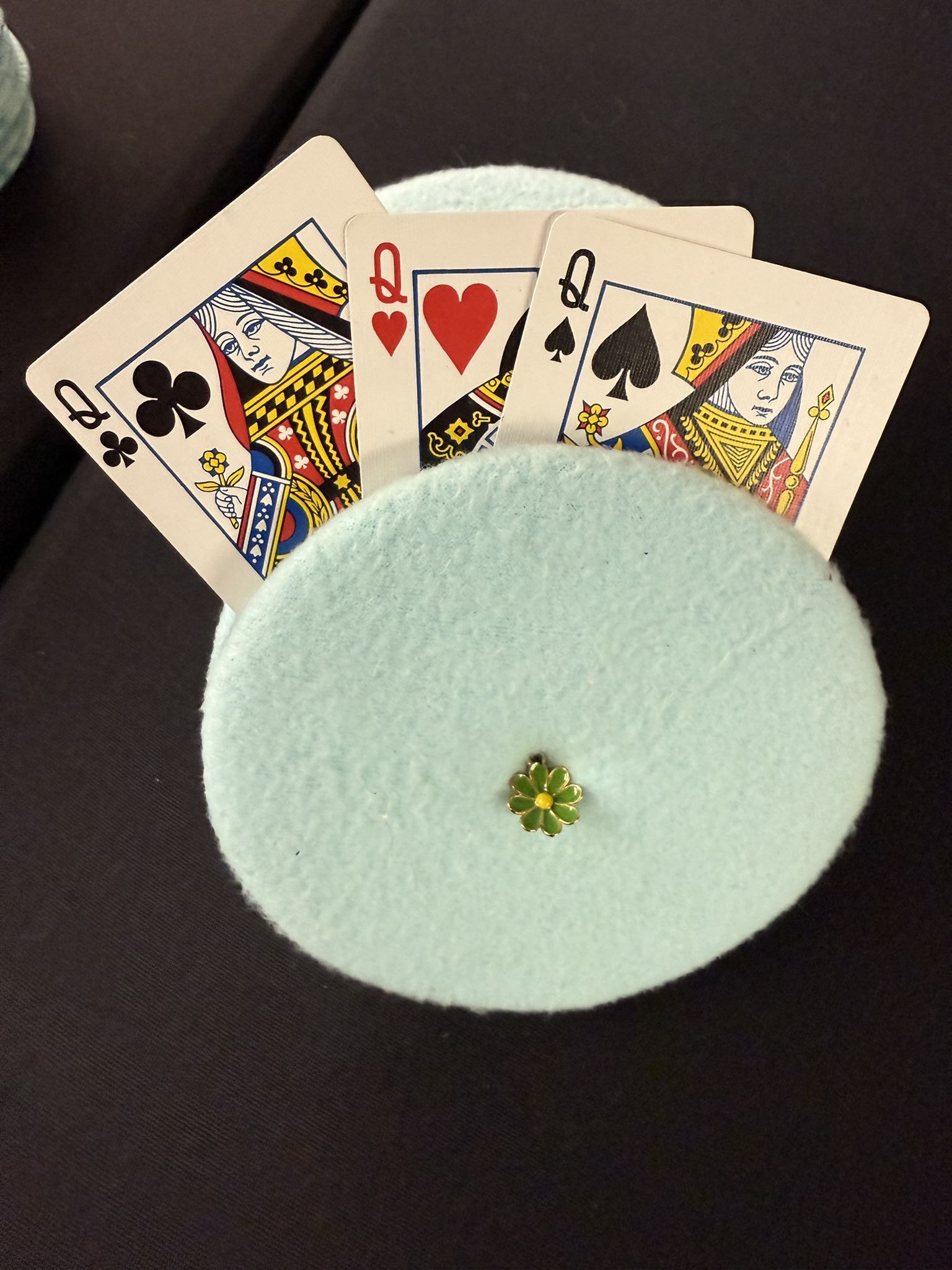 turquoise playing cards holder with green flower charm