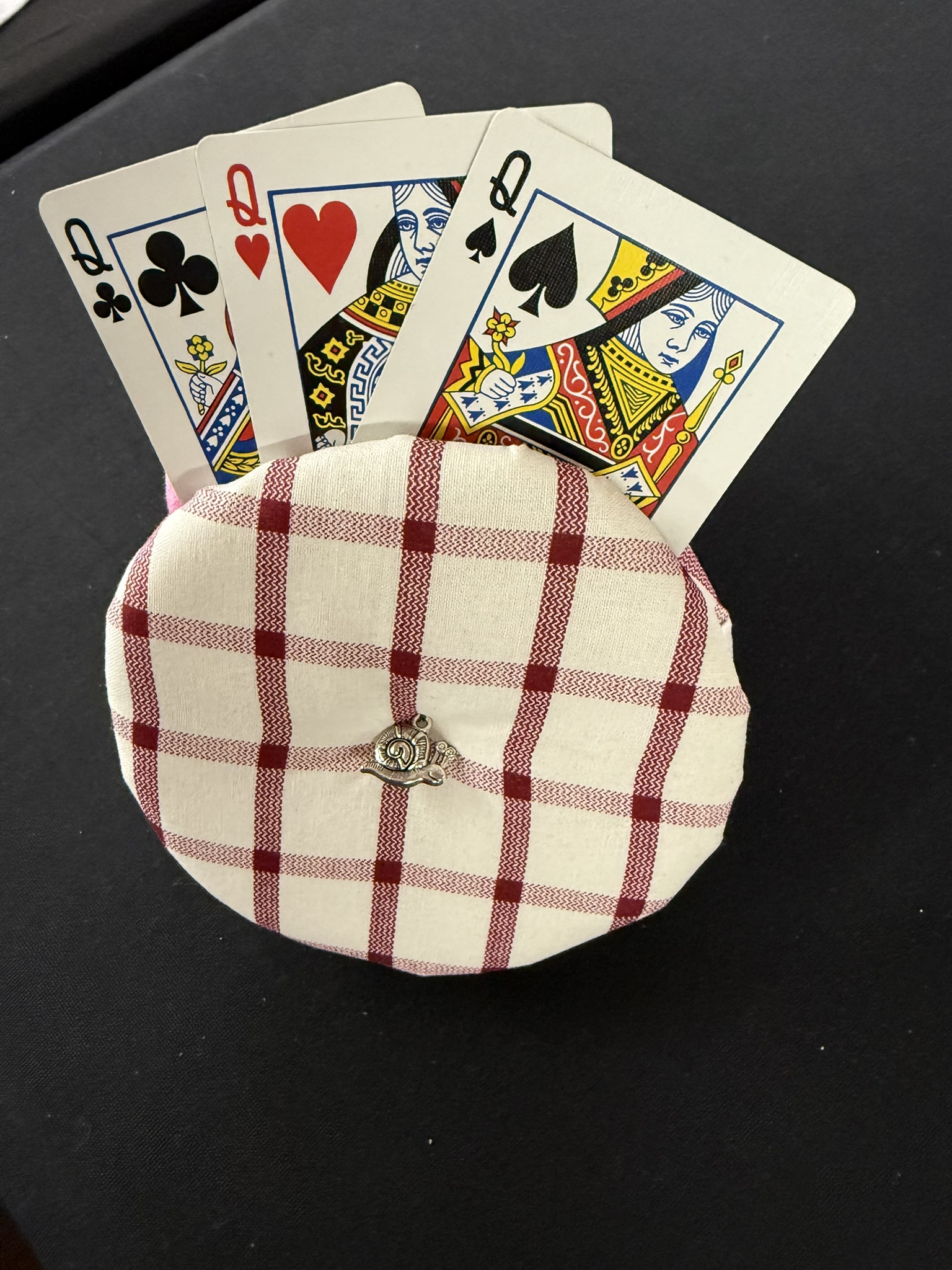 white and red plaid playing cards holder with snail charm