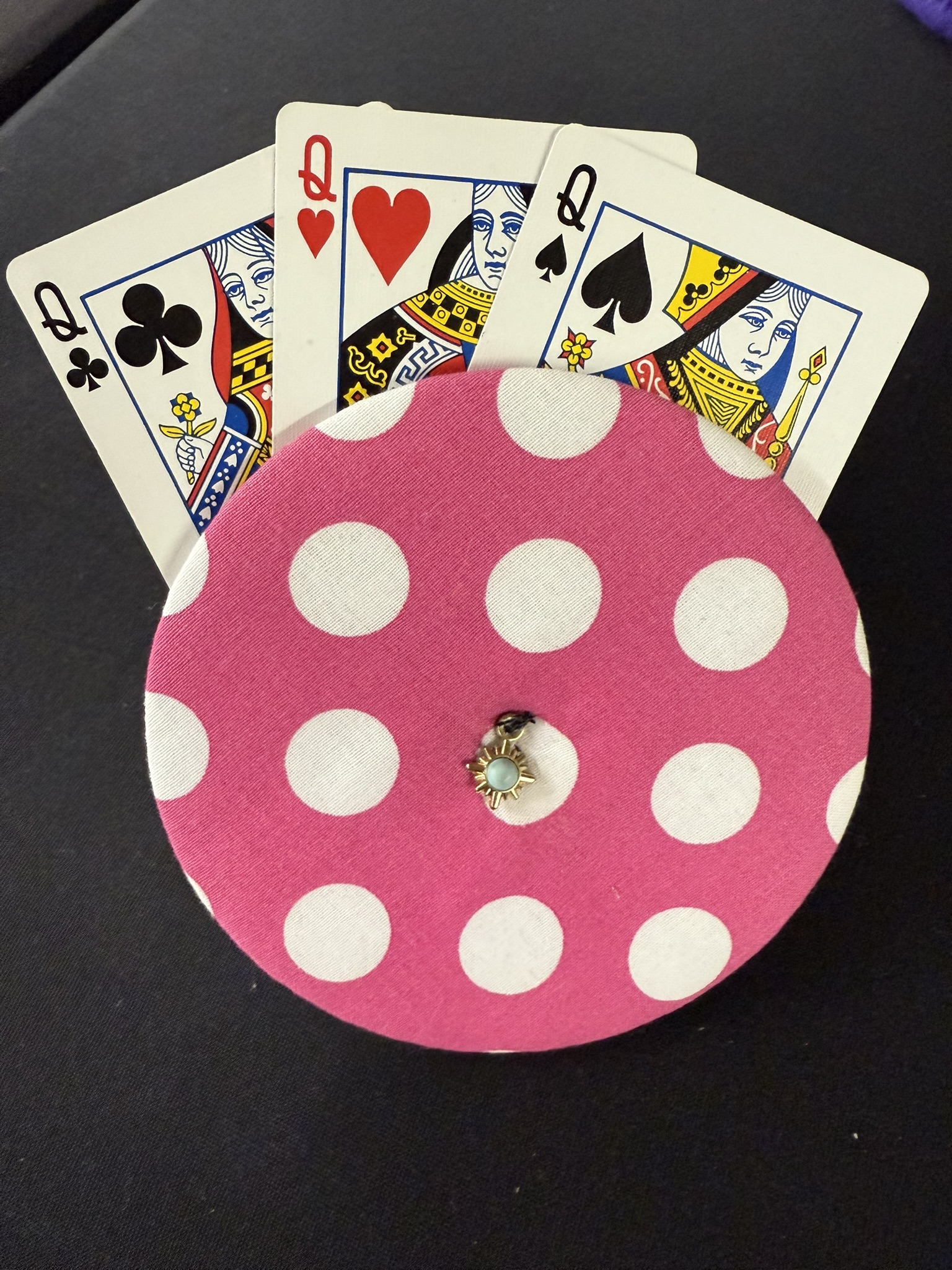 pink with white polka dots pattern playing cards holder with sun charm