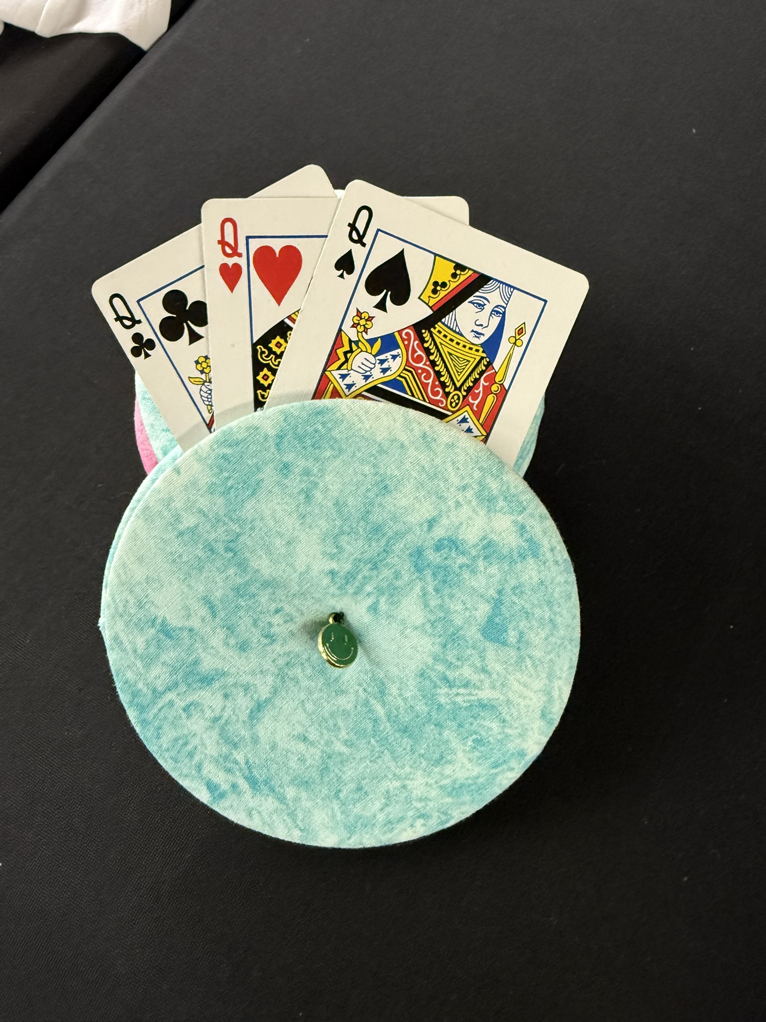 turquoise playing cards holder with green smiley face charm