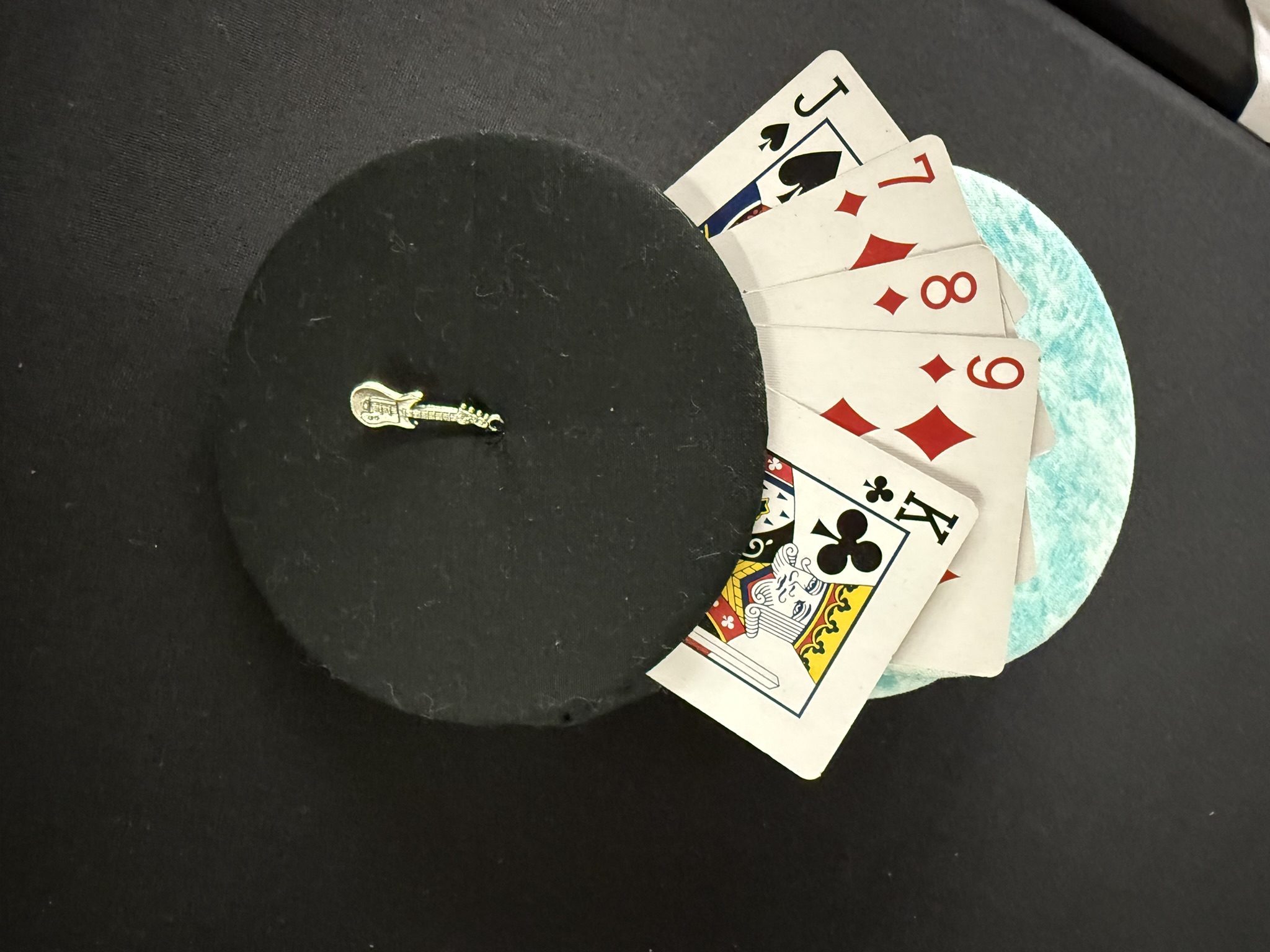 black playing cards holder with guitar charm